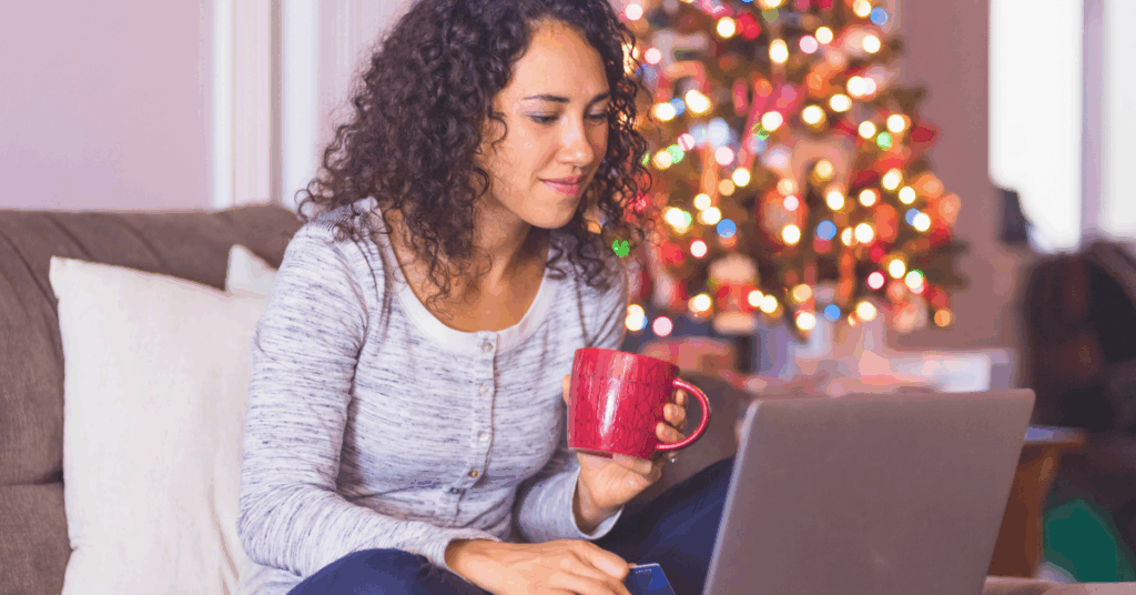 Woman on her laptop making a holiday budget