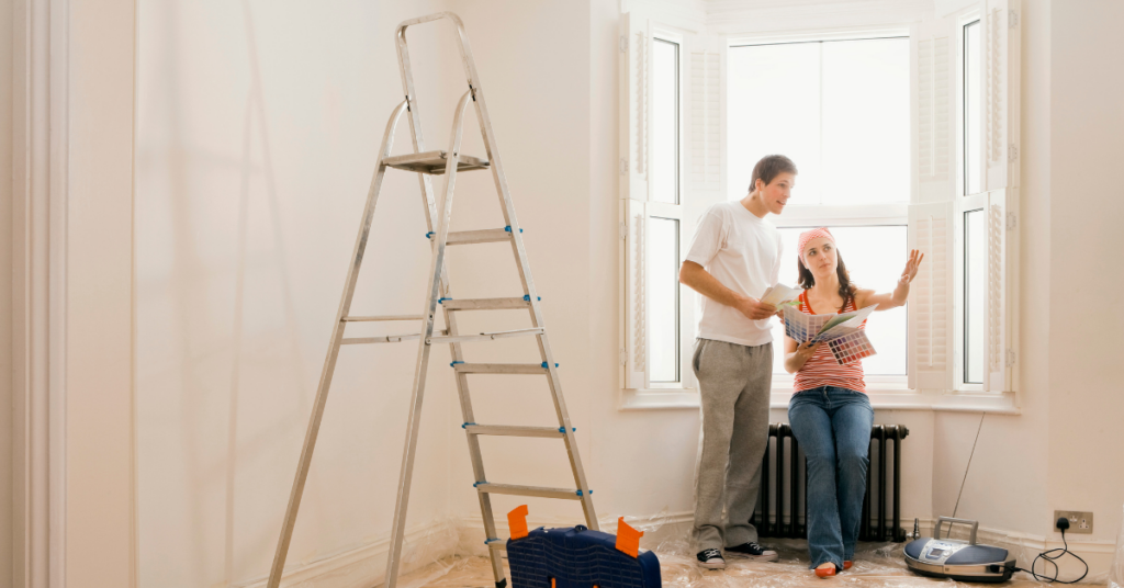 A young married couple planning home improvement projects